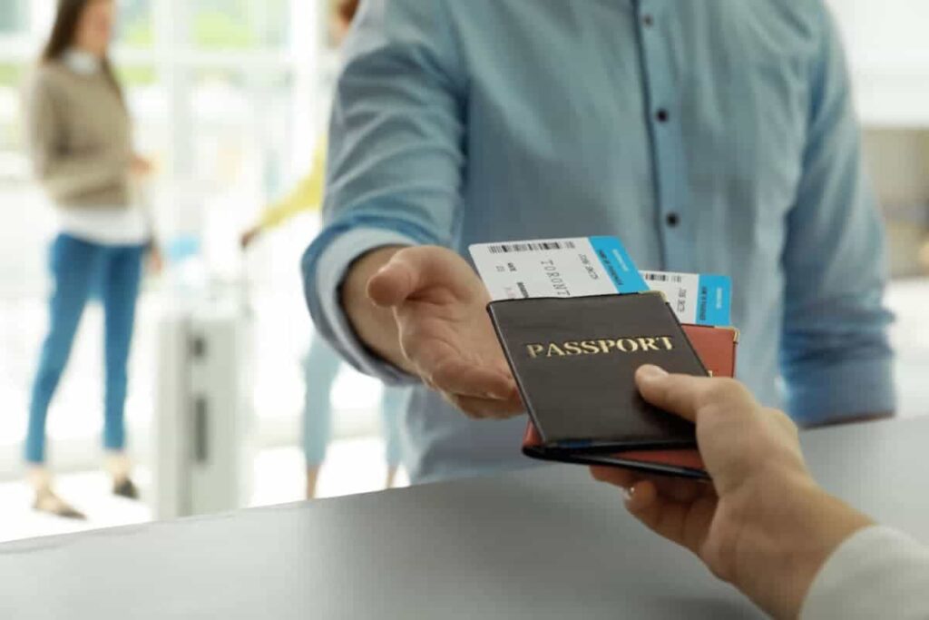 Passenger is checking-in and giving the passport at the counter