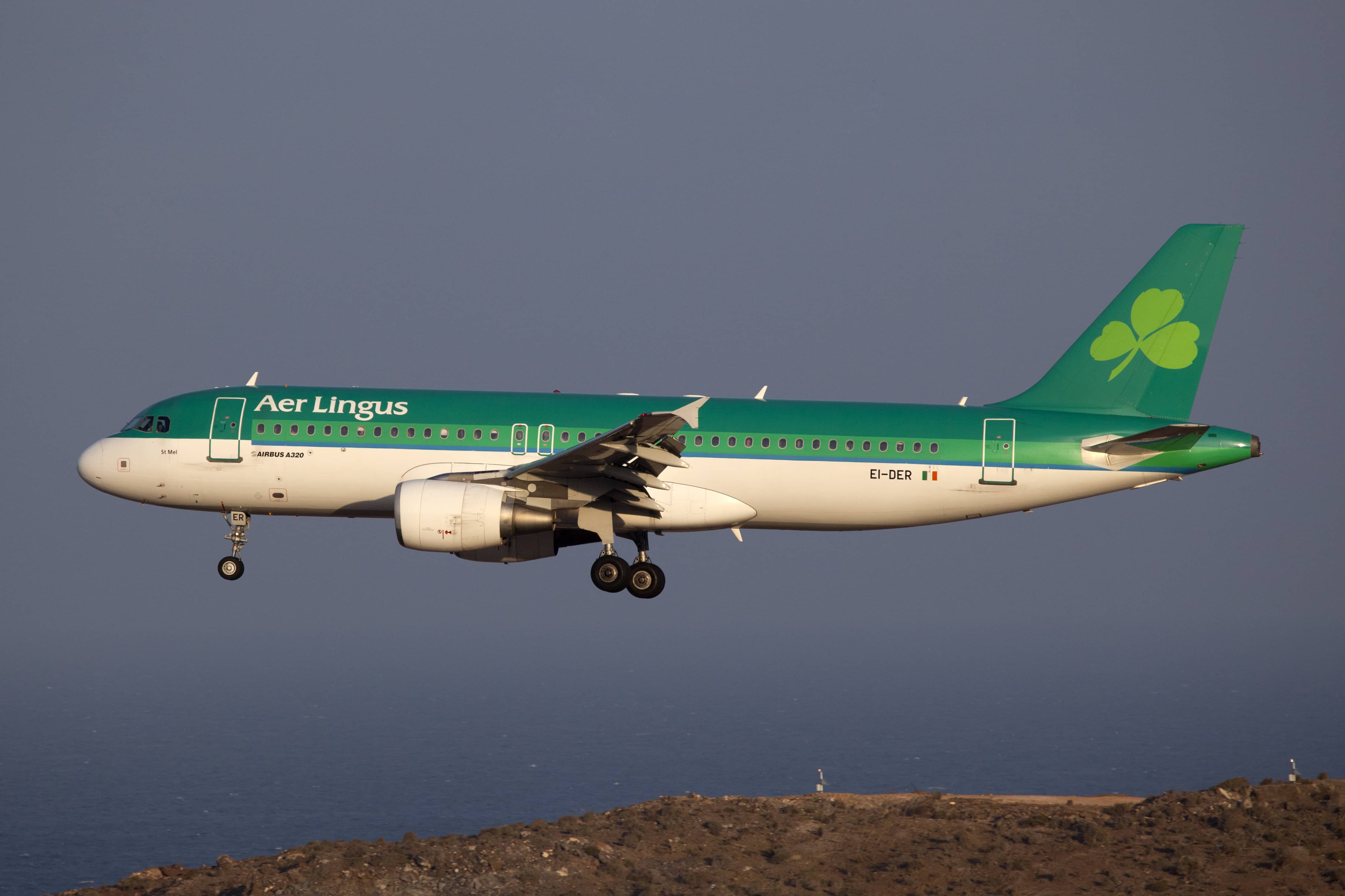 Gran Canaria, Spain - October 6, 2011: An Aer Lingus Airbus A320 on approach to the airport of Gran Canaria (LPA). Aer Lingus is the Irish flag carrier and operates a fleet of Airbus aircraft only. The airline's main hub is at Dublin airport. It carried 9.3 million passengers in 2010 with a fleet of 44 aircraft.