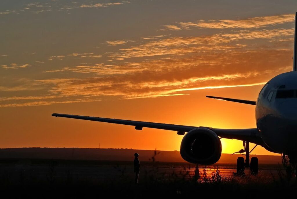 aircraft on runway in sunset